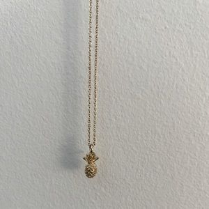 Golden pineapple necklace.